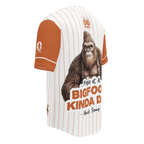 Baseball-style shirt with a Bigfoot graphic and text on a white background