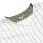 Close-up of a white baseball jersey with green collar and 'Rawlings' branding.