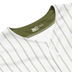 Close-up of a white baseball jersey with green accents and a brand logo on the collar.