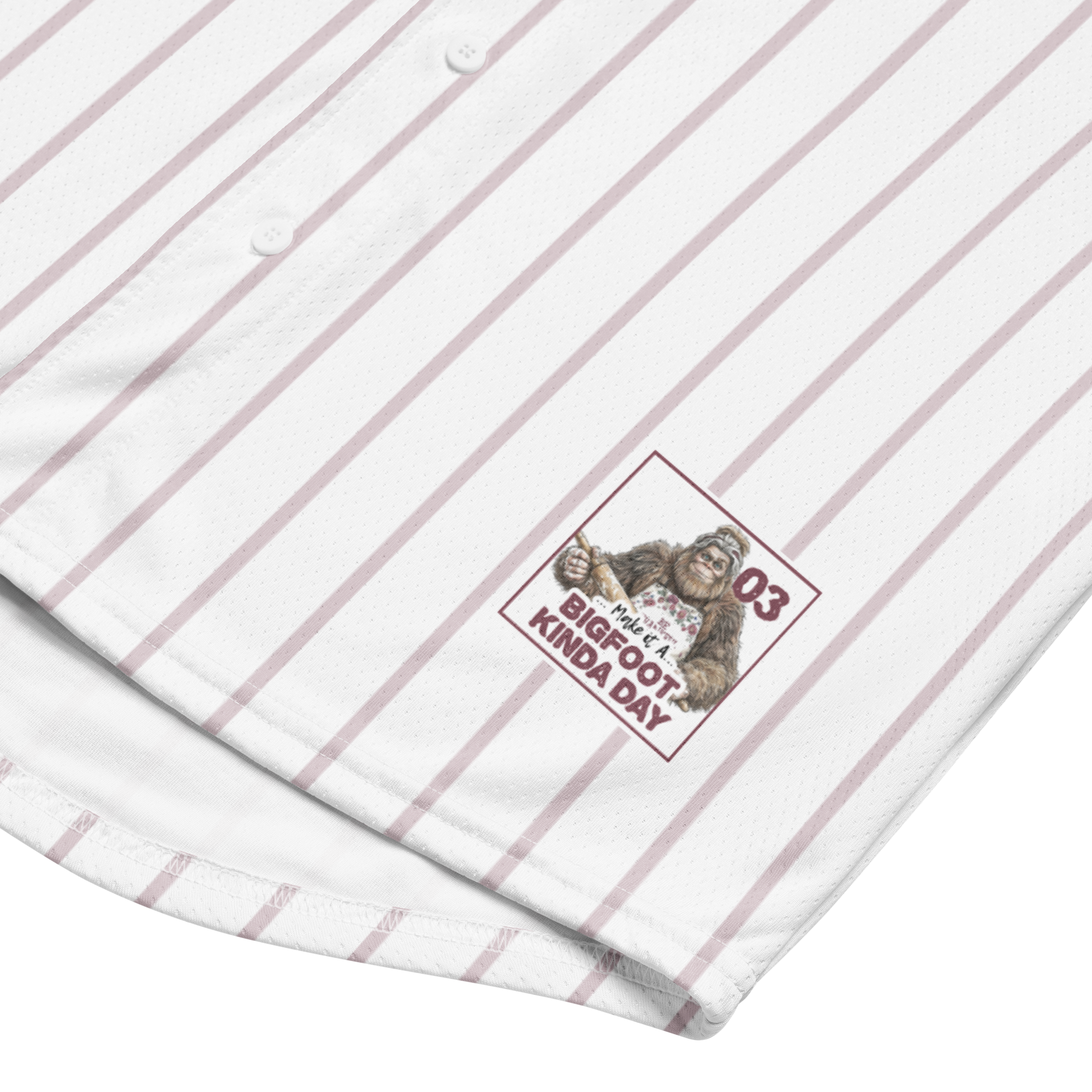 White shirt with yellow pinstripes and a logo featuring a monkey and text on a white background